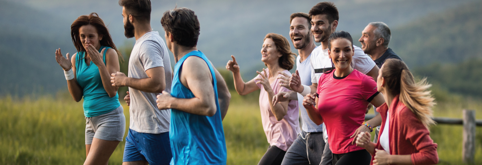 group of nine people running outside